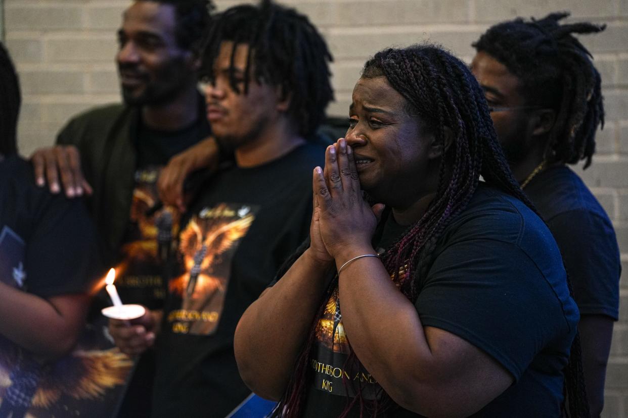 Shanta Miller cries while watching home videos of her late son, Malachi Williams, at a vigil outside the San Marcos Public Library on Thursday in San Marcos. Williams was killed by San Marcos police on April 11.