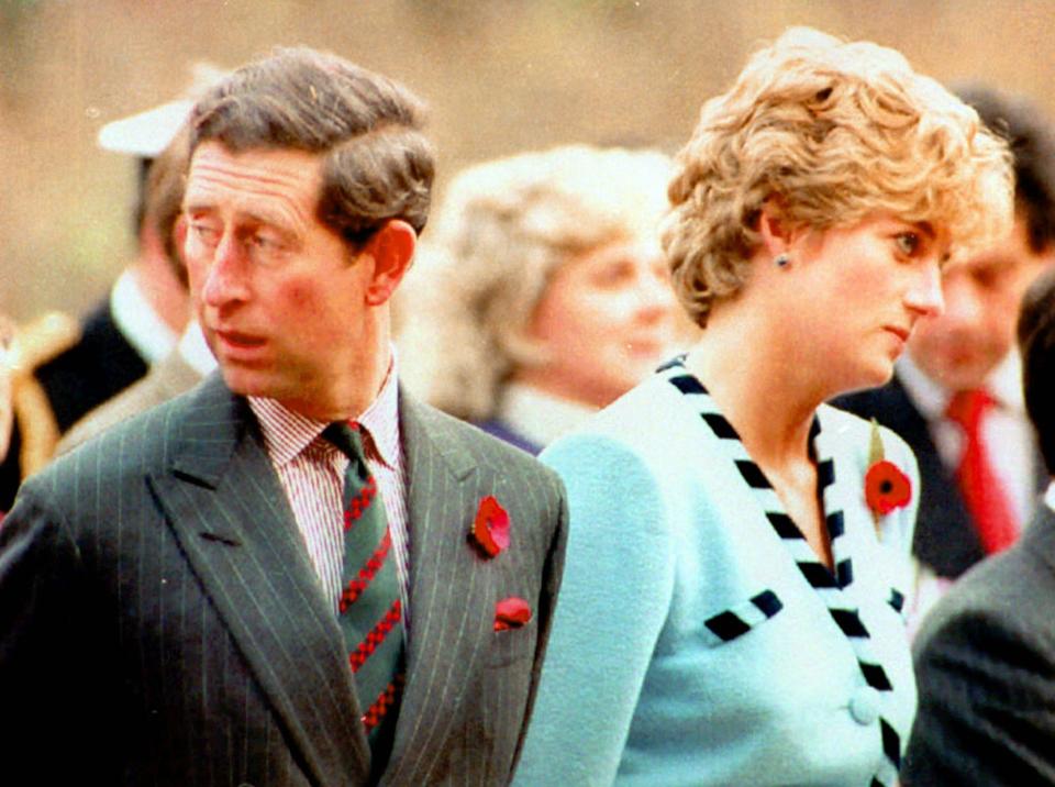 FILE - In this file photo taken on Wednesday, Dec. 20, 1992, Britain's Prince Charles and Princess Diana, look their separate ways, during a memorial service on their tour of South Korea. Prince Charles is readying the paperwork to claim his pension when he turns 65 on Thursday, Nov. 14, 2013, but he still hasn't started the job he was born to do. (AP Photo/File)