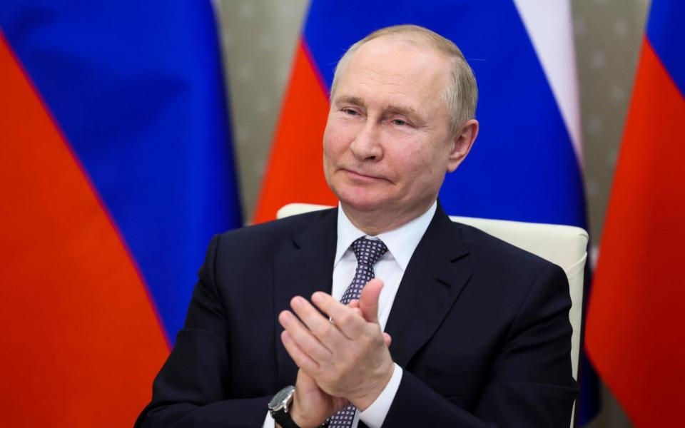Vladimir Putin Russia default - Mikhail Metzel/Sputnik, Kremlin Pool Photo via AP
