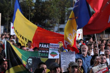 Protesters march during a rally in Bucharest, against plans to open Europe's biggest open-cast gold mine in Romania September 15, 2013. REUTERS/Bogdan Cristel