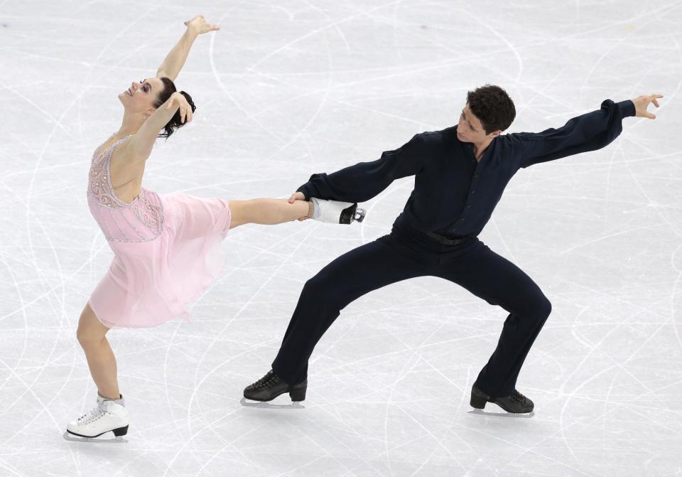 Tessa Virtue and Scott Moir of Canada compete in the ice dance free dance figure skating finals at the Iceberg Skating Palace during the 2014 Winter Olympics, Monday, Feb. 17, 2014, in Sochi, Russia. (AP Photo/Ivan Sekretarev)