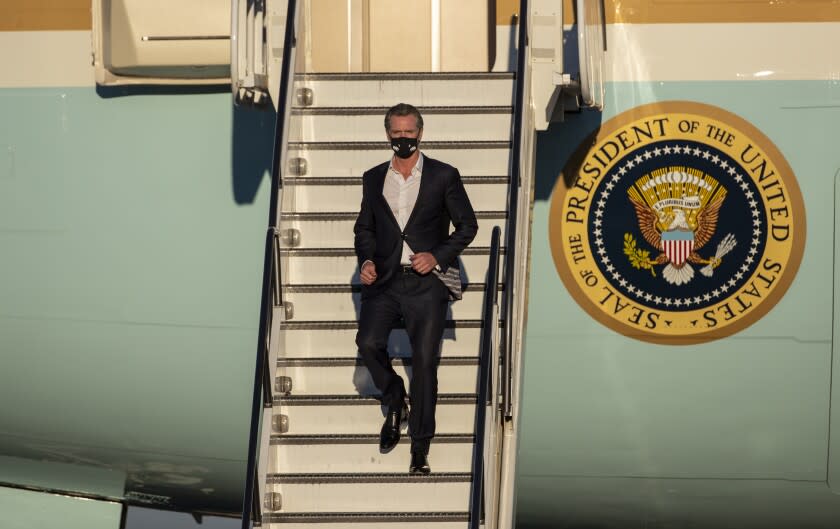 LONG BEACH, CA - September 13, 2021: California Gov. Gavin Newsom disembarks Air Force One at Long Beach Airport to join President Biden in his motorcade to attend a "No on Recall" rally the night before the recall election in Long Beach, California.(Gina Ferazzi / Los Angeles Times)