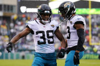 Jacksonville Jaguars' Jamal Agnew, left, celebrates his touchdown with teammate Christian Kirk during the first half of an NFL football game against the Philadelphia Eagles on Sunday, Oct. 2, 2022, in Philadelphia. (AP Photo/Matt Rourke)