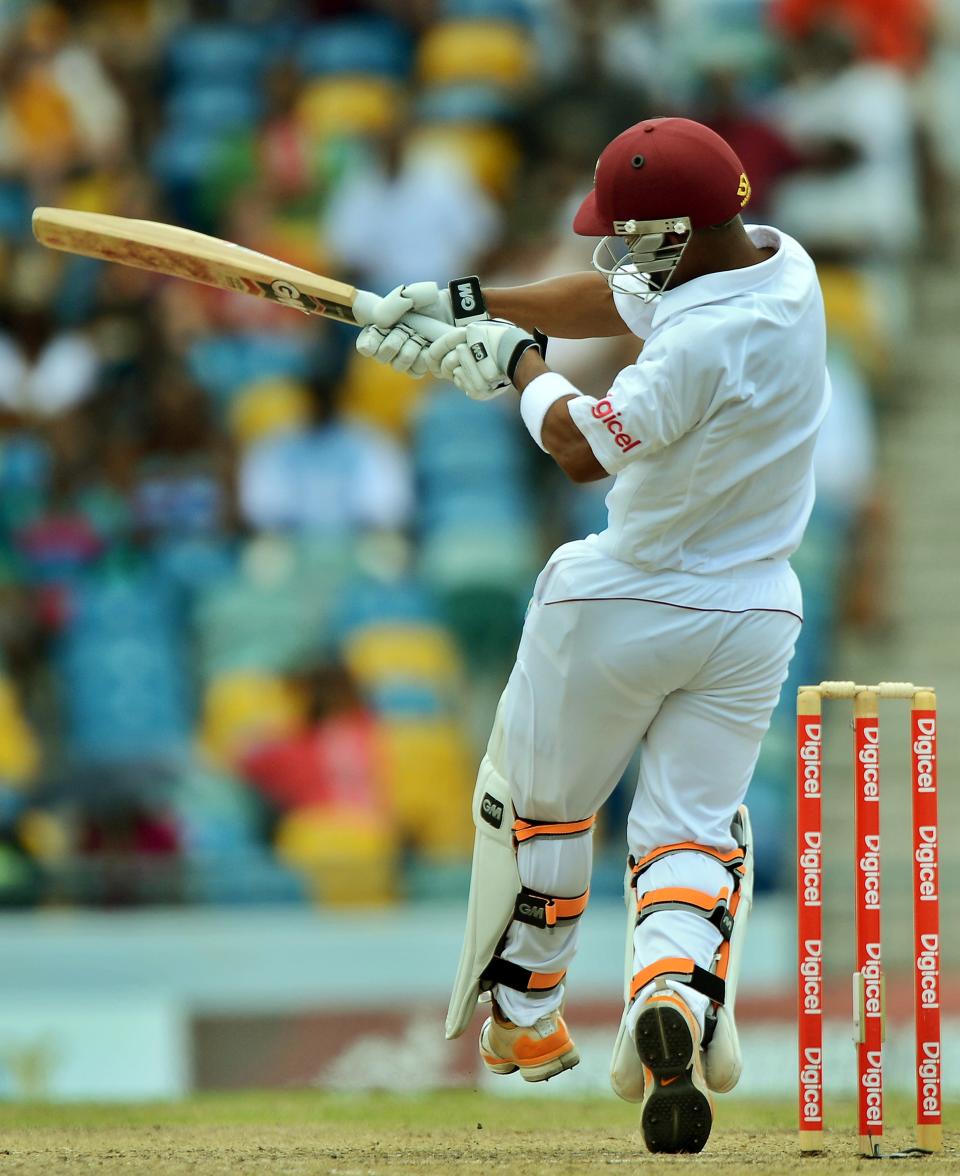 West Indies cricketer Carlton Baugh hits a boundary during the second day of the first-of-three Test matches between Australia and West Indies at the Kensington Oval stadium in Bridgetown on April 8, 2012. AFP PHOTO/Jewel Samad (Photo credit should read JEWEL SAMAD/AFP/Getty Images)