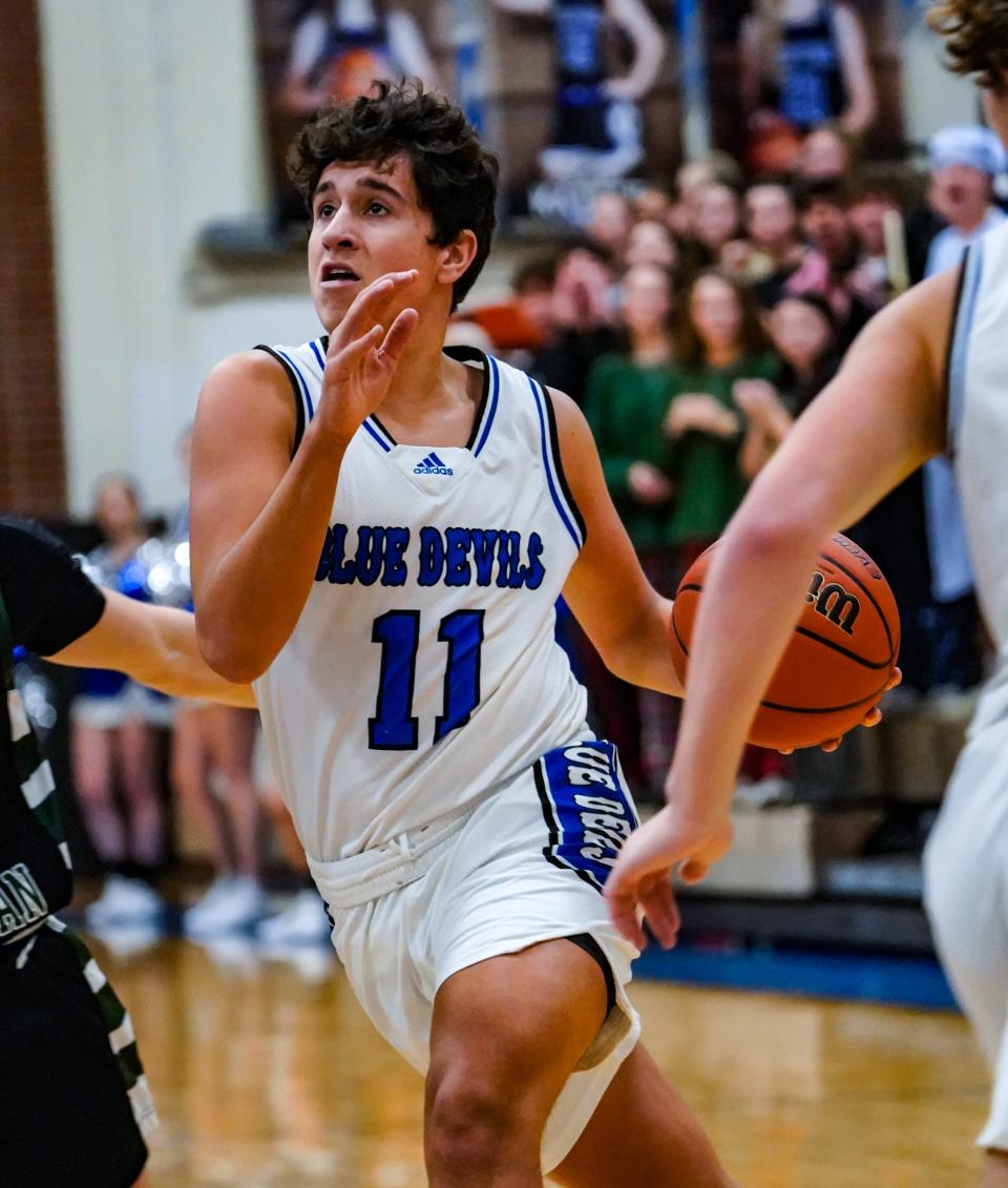 Tipton High School senior Nolan Swan (11) drives into the lane during a game between Tipton High School and Covenant Christian High School on Saturday, Dec. 16, 2023, at THS in Tipton Ind.