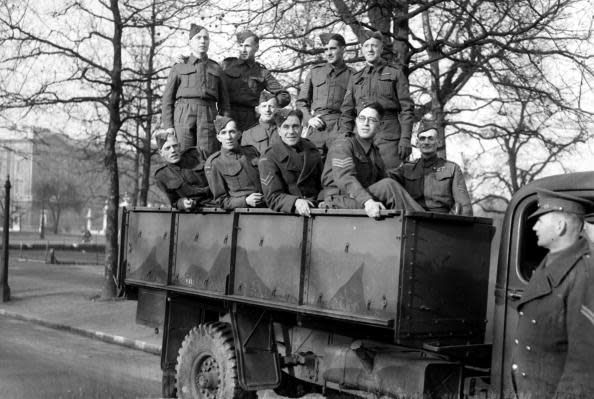 <p>Home Guard members in their uniforms parade through London in 1944. (Popperfoto/Getty Images)</p>