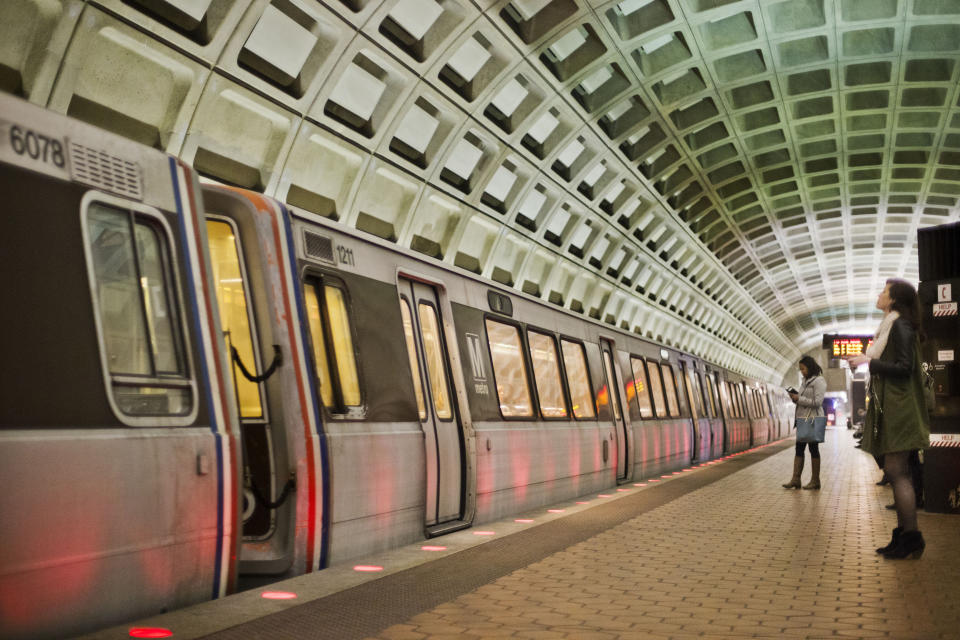 FILE - In this March 12, 2015 file photo, passengers wait on the platform before boarding a train at the U Street Metro Station in Washington, part of the public mass transit network for Washington. Washington’s regional Metro system abruptly pulled more than half its fleet of trains from service early Monday morning over a lingering problem with the wheels and axles that caused a dramatic derailing last week. (AP Photo/Pablo Martinez Monsivais)