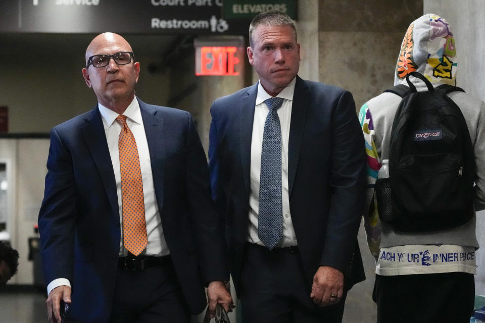 Howard Redmond, center, walks inside Manhattan Criminal Court Wednesday, Aug. 9, 2023, in New York. Redmond, the former head of police security for New York City's mayor, during the administration of Bill de Blasio, pleaded guilty on Wednesday to blocking an investigation into the misuse of city resources during the Democrat's failed presidential campaign. (AP Photo/Frank Franklin II)