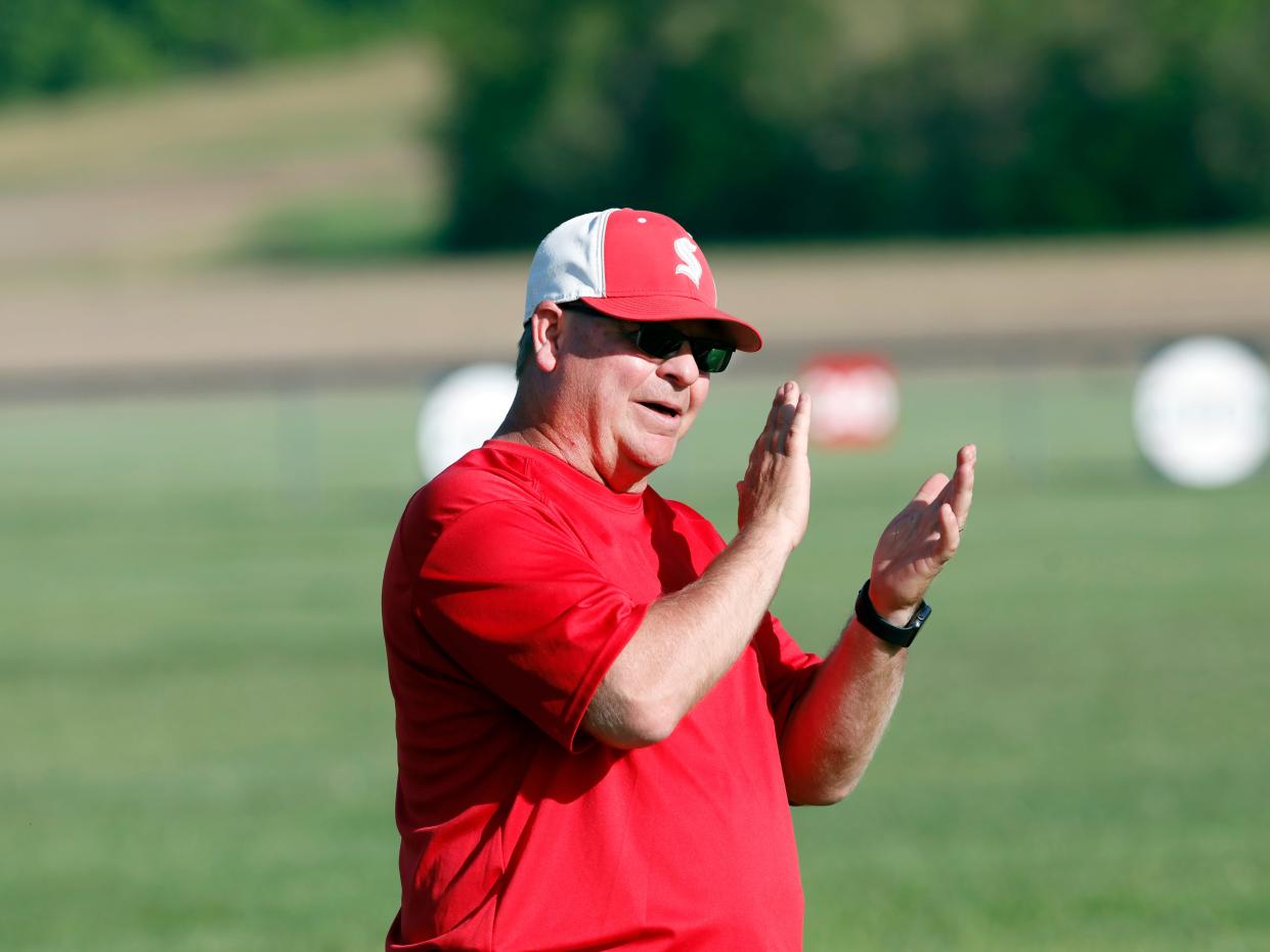 Head coach Doug Fisher encourages one of his hitters during Sheridan's 10-2 win against Hillsboro in a Division II sectional on May 15, 2023, in Thornville. Fisher reached 400 wins for his career on Tuesday.