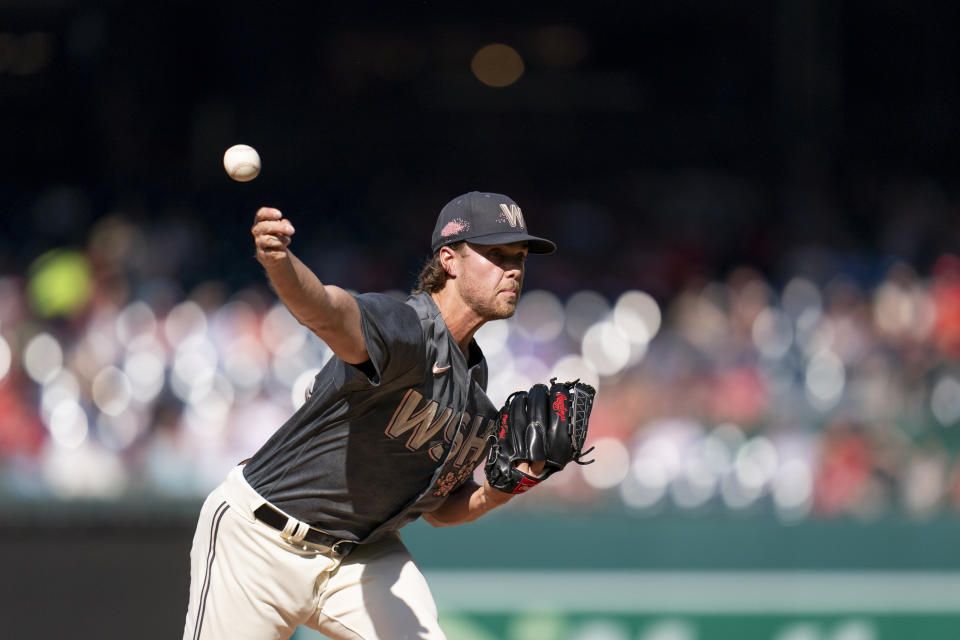 Washington Nationals starting pitcher Jake Irvin delivers during the second inning of a baseball game against the Philadelphia Phillies, Saturday, Aug. 19, 2023, in Washington. (AP Photo/Stephanie Scarbrough)