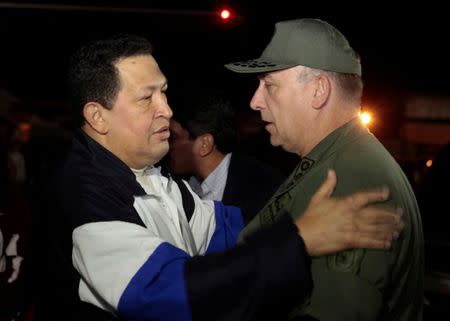 FILE PHOTO: Venezuela's President Hugo Chavez (L) talks to Venezuela's Defense Minister Admiral Diego Alfredo Molero, in Caracas, Venezuela, December 7, 2012. Miraflores Palace/Handout via REUTERS/File Photo