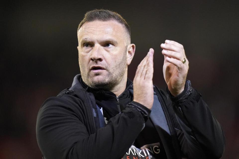 Evatt applauds the travelling fans after the final whistle <i>(Image: PA)</i>