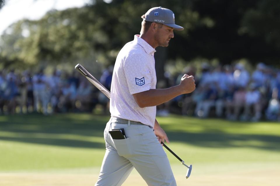 Bryson DeChambeau celebrates after a birdie on the 14th hole during third round at the Masters golf tournament at Augusta National Golf Club Saturday, April 13, 2024, in Augusta, Ga. (AP Photo/Ashley Landis)
