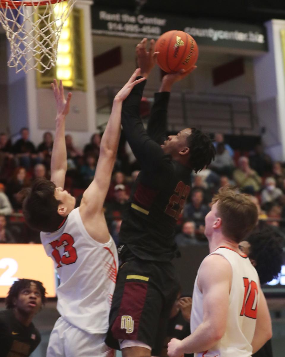 Mt. VernonÕs Justin Muhammad (22) puts up a shot against White Plains during the Section 1 Class AAA semifinal at the Westchester County Center in White Plains Feb. 28, 2024.