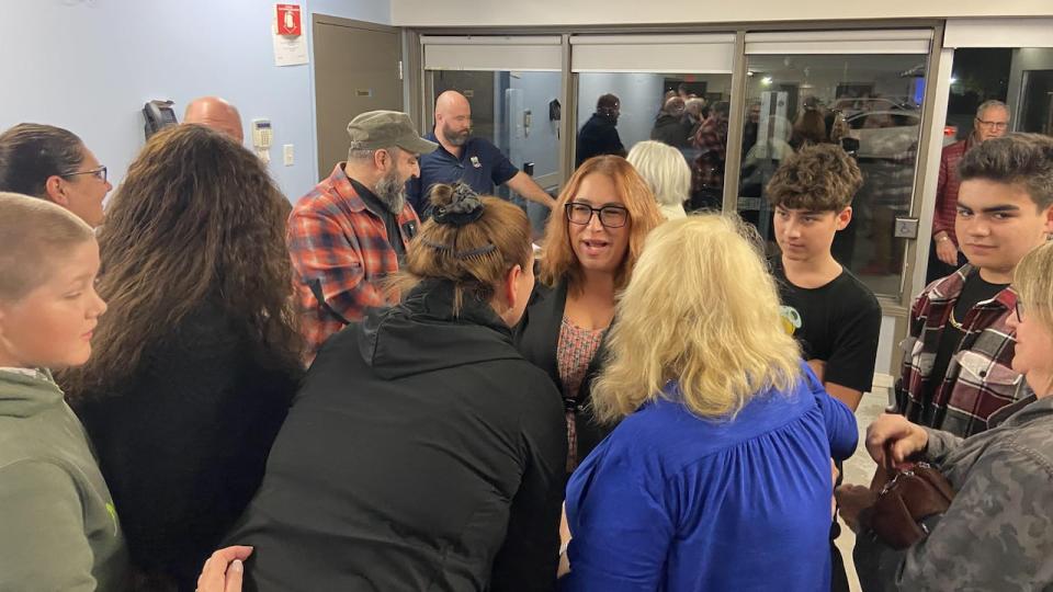 Casselman Mayor Geneviève Lajoie, centre, speaks to supporters after being elected as the eastern Ontario's town's new mayor on Oct. 24, 2022.