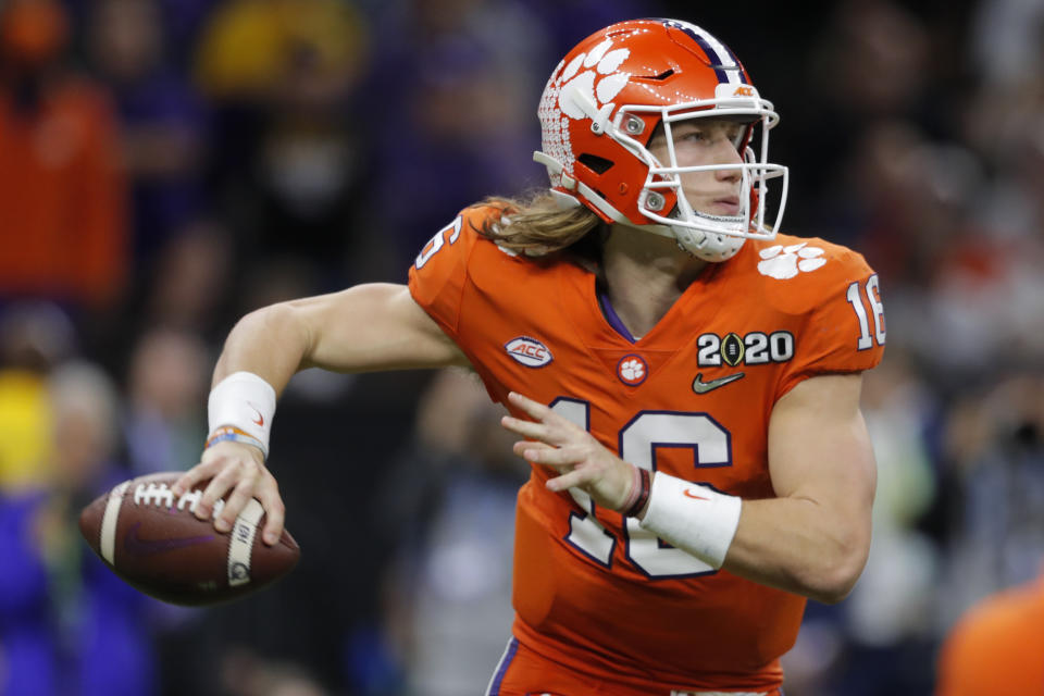 FILE - In this Jan. 13, 2020, file photo, Clemson quarterback Trevor Lawrence passes against LSU during the second half of a NCAA College Football Playoff national championship game, in New Orleans. Clemson is preseason No. 1 in The Associated Press Top 25, Monday, Aug. 24, 2020, a poll featuring nine Big Ten and Pac-12 teams that gives a glimpse at what’s already been taken from an uncertain college football fall by the pandemic. (AP Photo/Gerald Herbert, File)