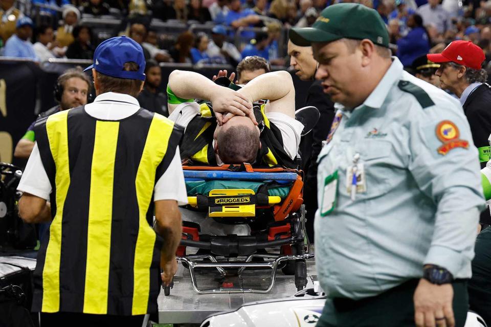 <p>AP Photo/Butch Dill</p> A member of the chain crew is wheeled off during the first half of an NFL football game between the New Orleans Saints and the Detroit Lions