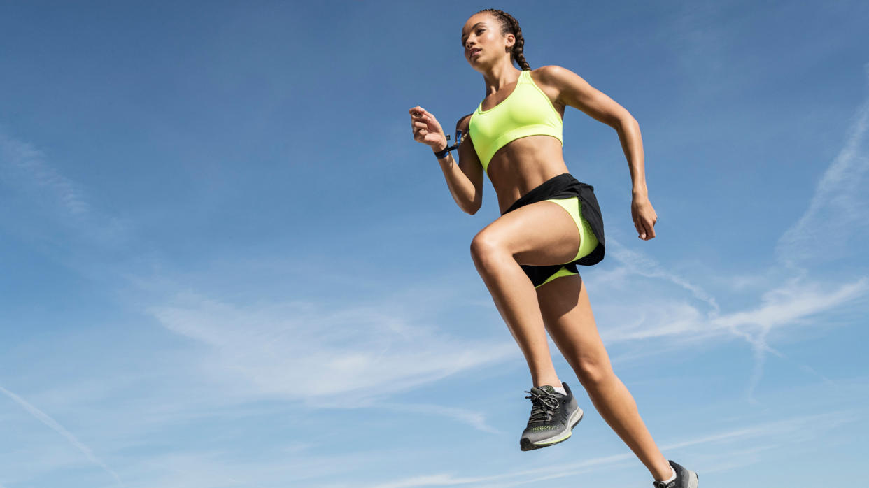  A woman running in a pair of shorts. 