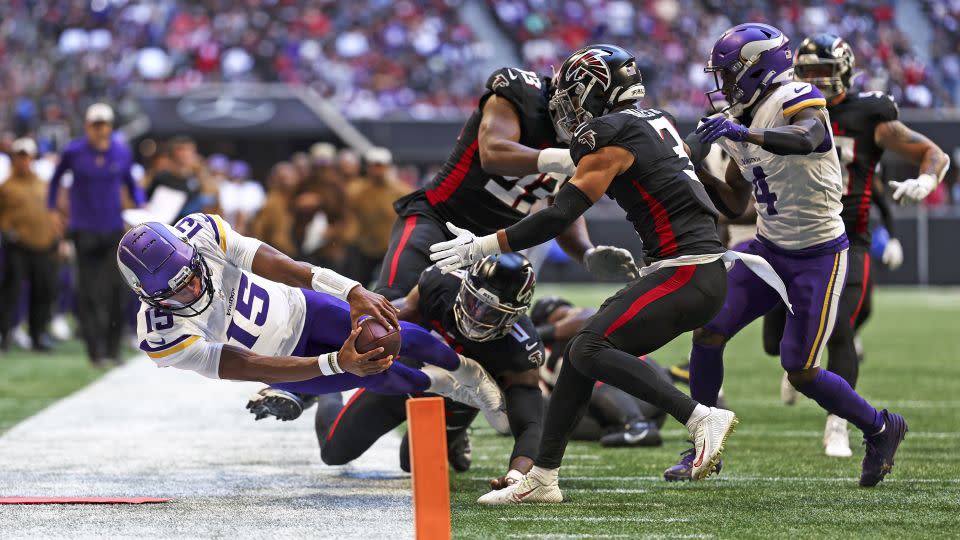 Dobbs reaches for the pylon during the second quarter of the game against the Atlanta Falcons. - Kevin Sabitus/Getty Images