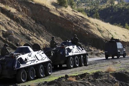 Turkish soldiers in armored vehicles patrol in Sirnak province on the Turkish-Iraqi border October 21, 2011. REUTERS/Nail Kadirhan/Anadolu Agency