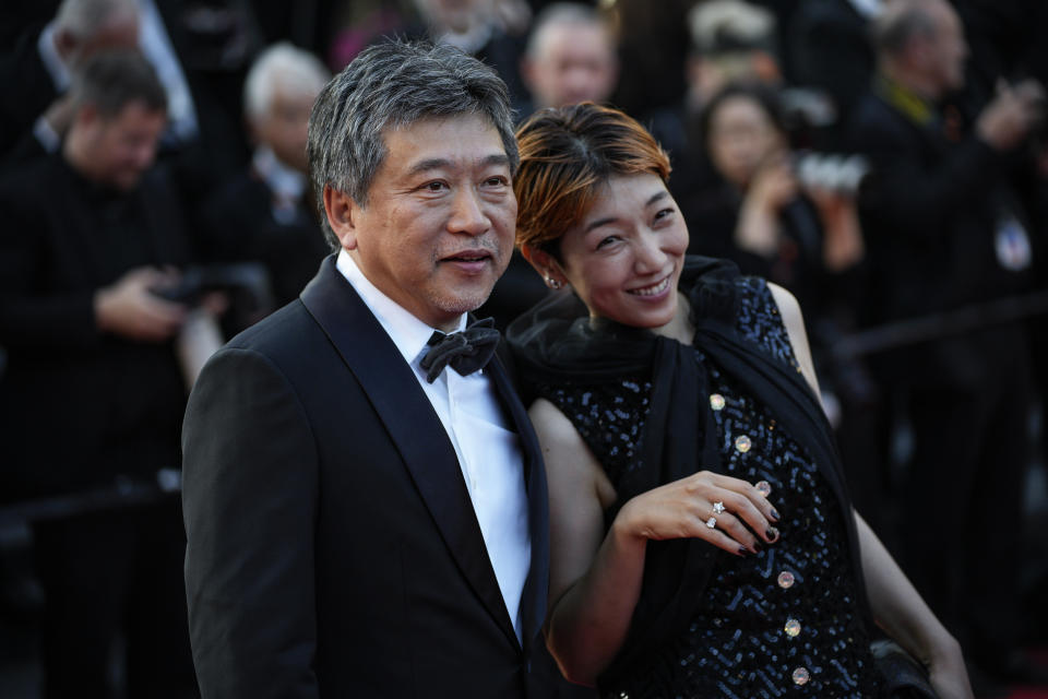 Hirokazu Koreeda, left, and Sakura Ando pose for photographers upon arrival at the awards ceremony during the 76th international film festival, Cannes, southern France, Saturday, May 27, 2023. (AP Photo/Daniel Cole)