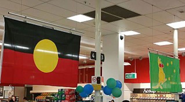 Also flying inside a Coles supermarket was an Aboriginal flag alongside a boxing kangaroo flag.  Source: Supplied.