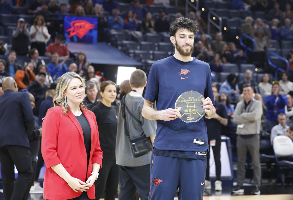 Dec 31, 2023; Oklahoma City, Oklahoma, USA; Oklahoma City Thunder forward Chet Holmgren (7) smiles as he receives the NBA Rookie of the Month Trophy for Oct./Nov. before the start of a game against the Brooklyn Nets at Paycom Center. Mandatory Credit: Alonzo Adams-USA TODAY Sports