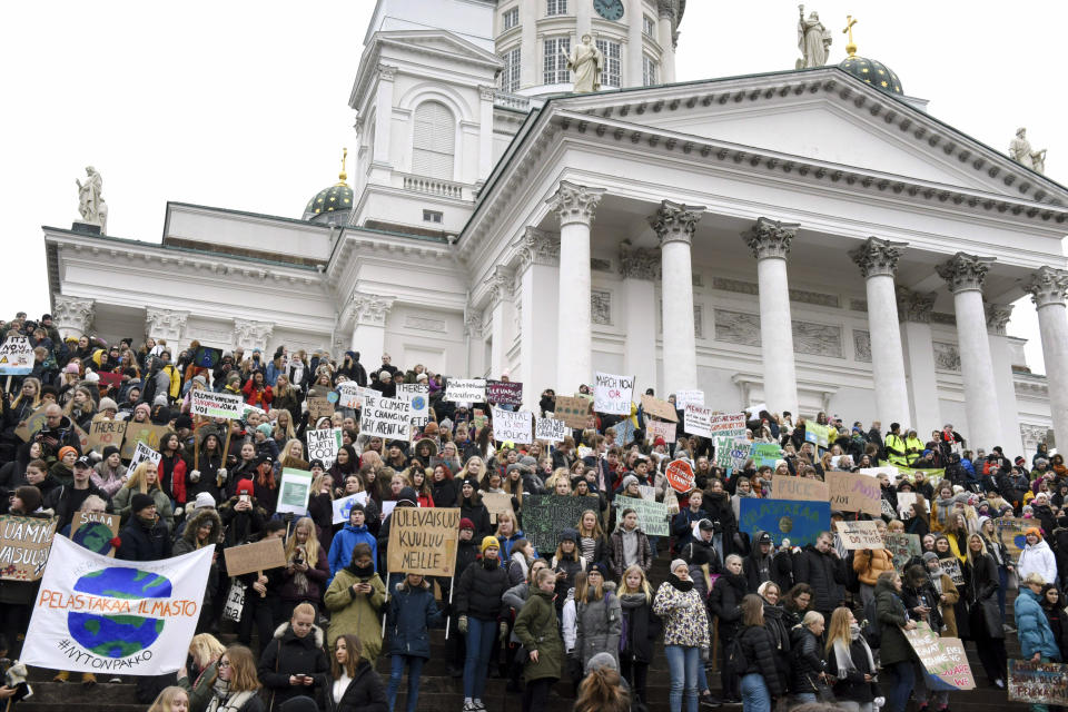 Young demonstrators gather on the steps of the Helsinki Cathedral, prior to the start of a protest march of Finnish youth calling for climate protection, in Helsinki, Finland, Friday, March 15, 2019. (Heikki Saukkomaa/Lehtikuva via AP)