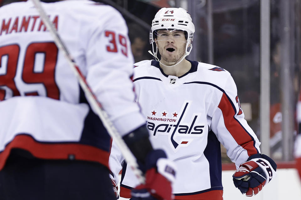 Washington Capitals center Connor McMichael celebrates his goal against the New Jersey Devils with Anthony Mantha during the third period of an NHL hockey game Wednesday, Oct. 25, 2023, in Newark, N.J.(AP Photo/Adam Hunger)