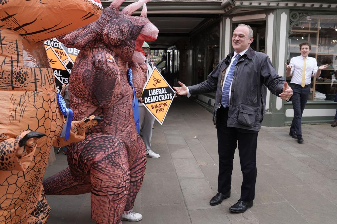Liberal Democrat leader Sir Ed Davey is greeted by Tory 'dinosaurs' as he arrives to join local Lib Dem campaigners at a celebratory rally in Winchester, following the results in local government elections. Picture date: Friday May 3, 2024.