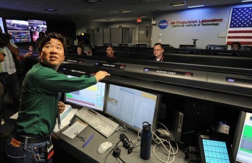 Mars Science Laborator's lead flight director David Oh speaks to reporters gathered in the Mission Control room at the Jet Propulsion Laboratory in Pasadena on August 2. Attempts by global space agencies since 1960 have resulted in a near 40 percent success rate in sending landers, orbiters or other spacecraft for flybys to Mars. NASA has the best record