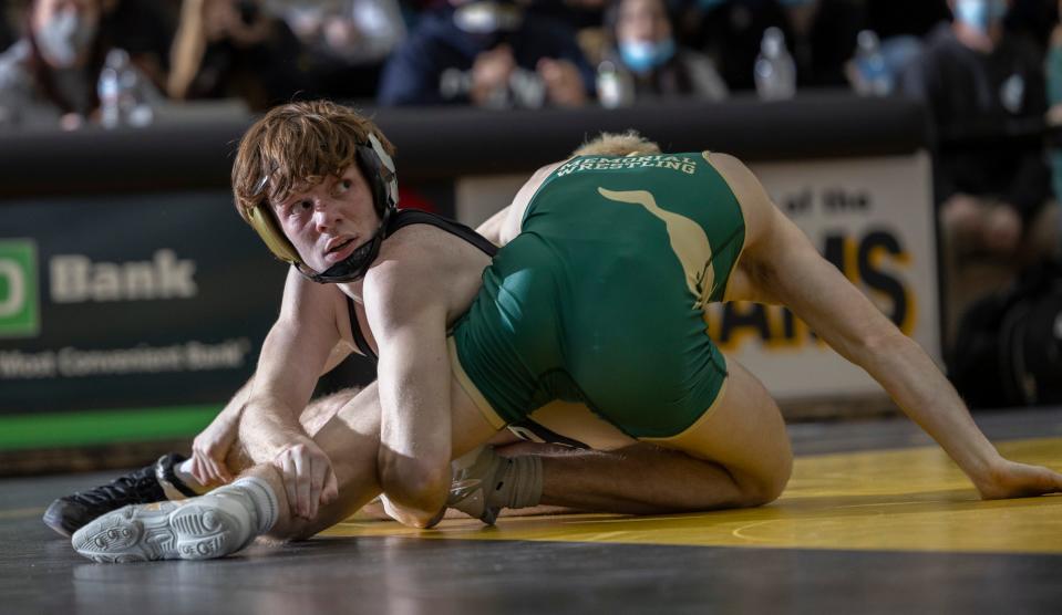 Southern Regional's two-time state top three finisher Conor Collins (left), shown during his regular season win over Brick Memorial's two-time state champion Evan Tallmadge last Jan.. 6, is one of the leaders of a Southern team that is ranked No. 2 in the Asbury Park Press Top 10.