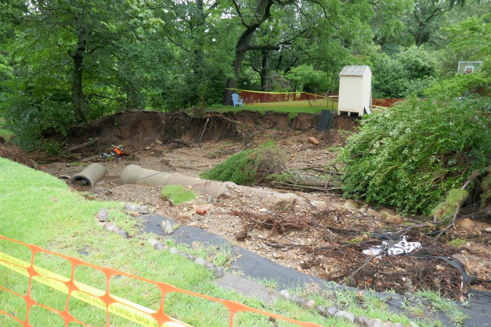 This large sinkhole developed across two residential properties on Maplevale Drive in Lower Makefield Saturday when a drainage pipe that was supposed to take water to the nearby Delaware Canal cracked.  Homes on the street also suffered flood damage.