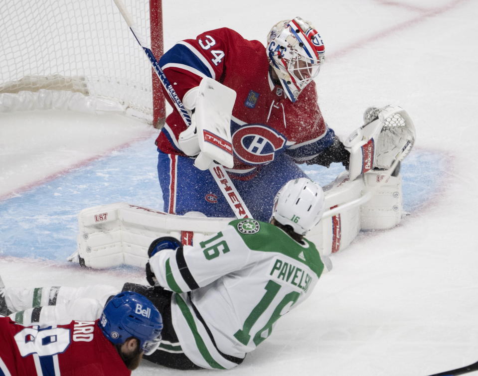 Montreal Canadiens goaltender Jake Allen (34) stops Dallas Stars' Joe Pavelski (16) during second-period NHL hockey game action Saturday, Oct. 22, 2022, in Montreal. (Ryan Remiorz/The Canadian Press via AP)