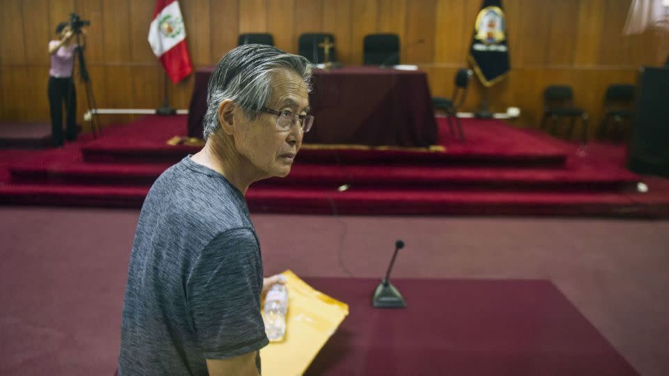 Peru's former President Alberto Fujimori arrives for the reading of a verdict on charges of embezzling state funds and using them to manipulate the media, at a police base in Lima on January 8, 2015. - Ernesto Benavides/AFP/Getty Images