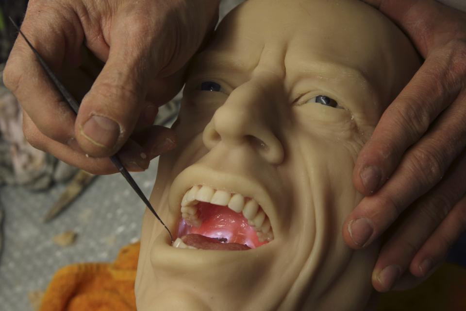 Paris' Grevin Wax Museum sculptor Eric Saint Chaffray works on the head of Rolling Stones lead singer Mick Jagger at their workshop in Paris