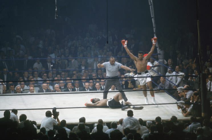 Muhammad Ali, who died on June 3 in a Phoenix hospital at 74 years of age, celebrates a 1965 knockout win of Sonny Liston. (Getty Images)