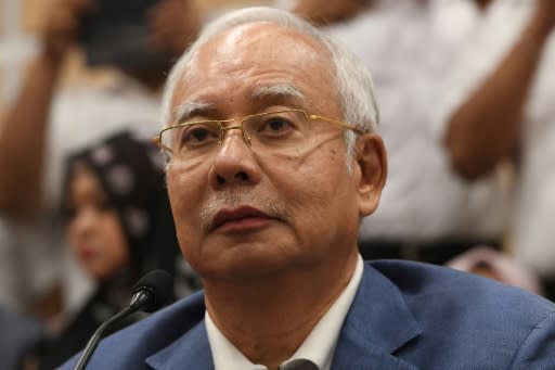 Najib Razak has announced he is quitting as head of the Barisan Nasional (BN) coalition as well as its main party