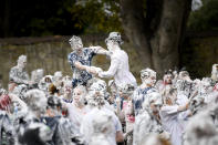 <p>Students from St Andrews University indulge in a tradition of covering themselves with foam to honor the “academic family” on Lower College Lawn on Oct. 23, 2017, in St Andrews, Scotland. (Photo: Jeff J Mitchell/Getty Images) </p>