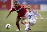 VANCOUVER, CANADA - JANUARY 21: Yisel Rodriguez #16 of Cuba knocks the ball away from Robyn Gayle #5 of Canada during the first half of the 2012 CONCACAF Women's Olympic Qualifying Tournament at BC Place on January 21, 2012 in Vancouver, British Columbia, Canada. (Photo by Rich Lam/Getty Images)