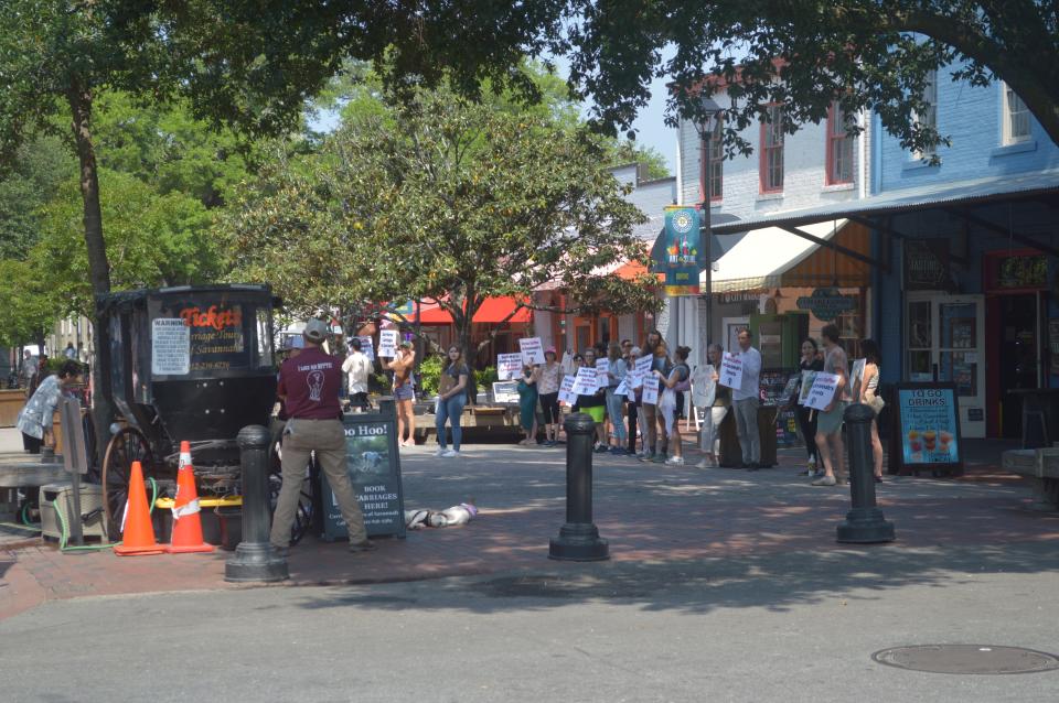 Members of local group Ban Horse Carriages Savannah protest to ban the use of horse-drawn carriages on April 20, 2024.