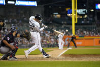 Detroit Tigers' Spencer Torkelson hits a RBI single during the sixth inning of a baseball game against the Cleveland Guardians, Tuesday, July 5, 2022, in Detroit. (AP Photo/Carlos Osorio)