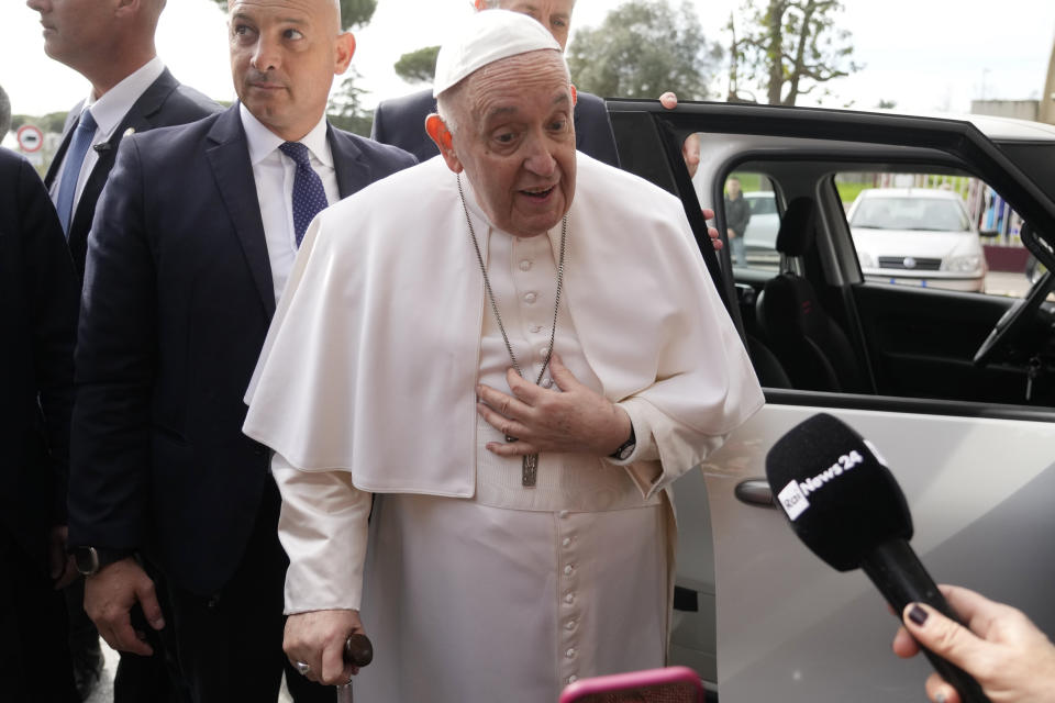 Pope Francis talks with journalists as he leaves the Agostino Gemelli University Hospital in Rome, Saturday, April 1, 2023 after receiving treatment for a bronchitis, The Vatican said. Francis was hospitalized on Wednesday after his public general audience in St. Peter's Square at The Vatican. (AP Photo/Gregorio Borgia)