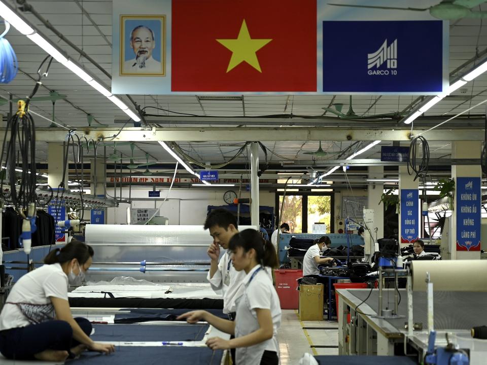Garment factory workers working in a factory in Hanoi, Vietnam.