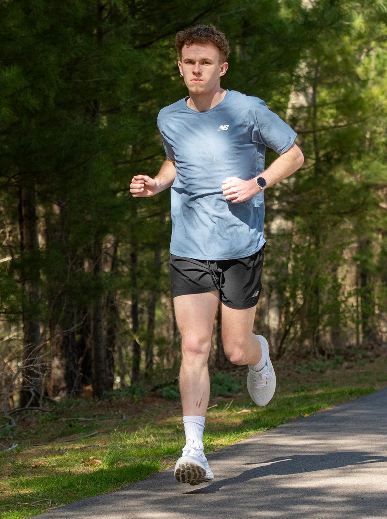 Northbridge runner Marcus Reilly shows his form on the Blackstone River Greenway last week.