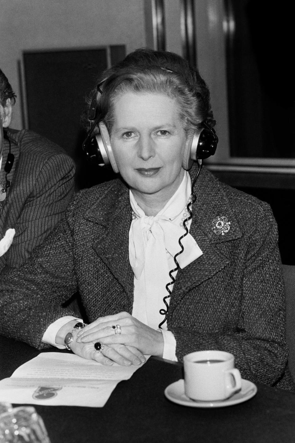 Prime Minister Margaret Thatcher wears earphones during an interview at the BBC’s Broadcasting House in March 1982 (PA) (PA Archive)