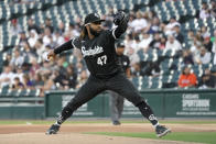 Chicago White Sox starting pitcher Johnny Cueto winds up during the first inning of the team's baseball game against the Houston Astros on Monday, Aug. 15, 2022, in Chicago. (AP Photo/Charles Rex Arbogast)