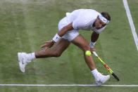 Spain's Rafael Nadal returns the ball during a men's quarterfinal match against United States' Sam Querrey on day nine of the Wimbledon Tennis Championships in London, Wednesday, July 10, 2019. (AP Photo/Kirsty Wigglesworth)