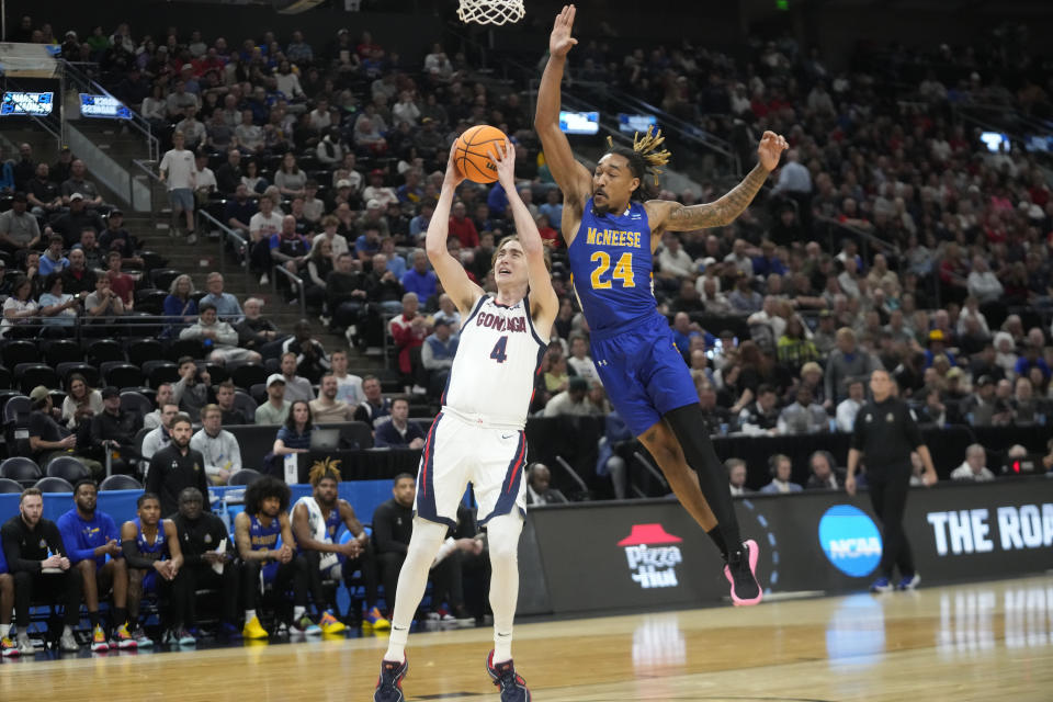 Gonzaga guard Dusty Stromer (4) shoots as McNeese State forward Christian Shumate (24) defends during the first half of a first-round college basketball game in the NCAA Tournament in Salt Lake City, Thursday, March 21, 2024. (AP Photo/Rick Bowmer)