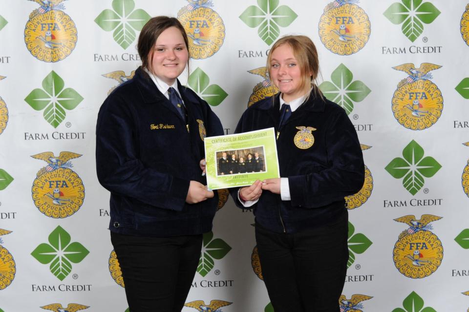 Olympia FFA representatives Tori Fishburn and Kylie Britt were recognized for coordinating a local campaign for the Illinois Foundation FFA which raised at least $6,000.